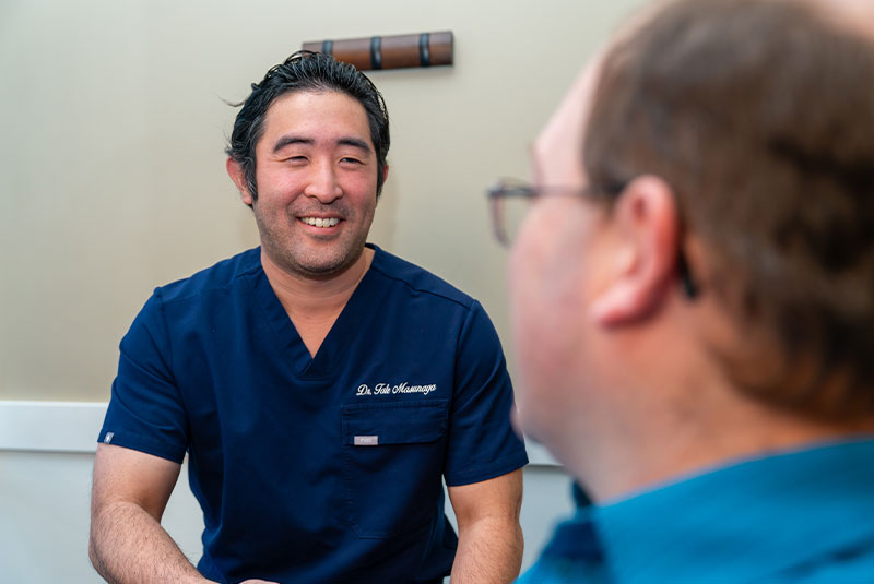 team member shaking patients hand