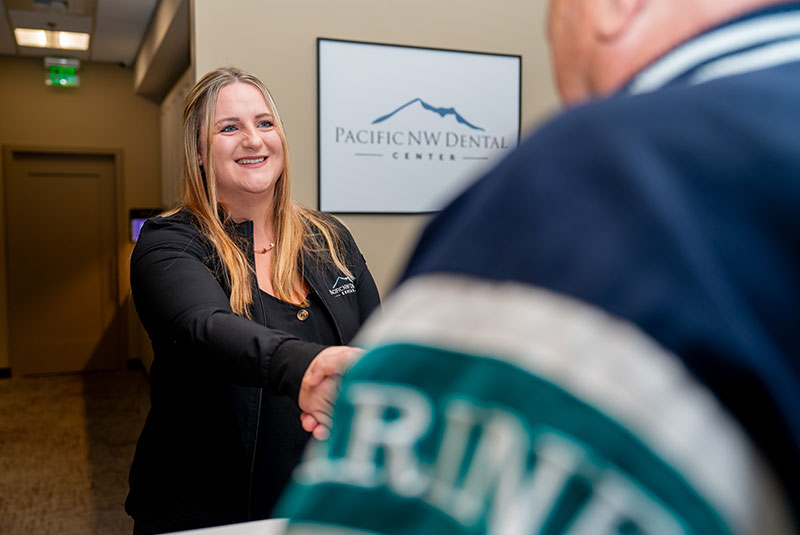 team member shaking Patients hand